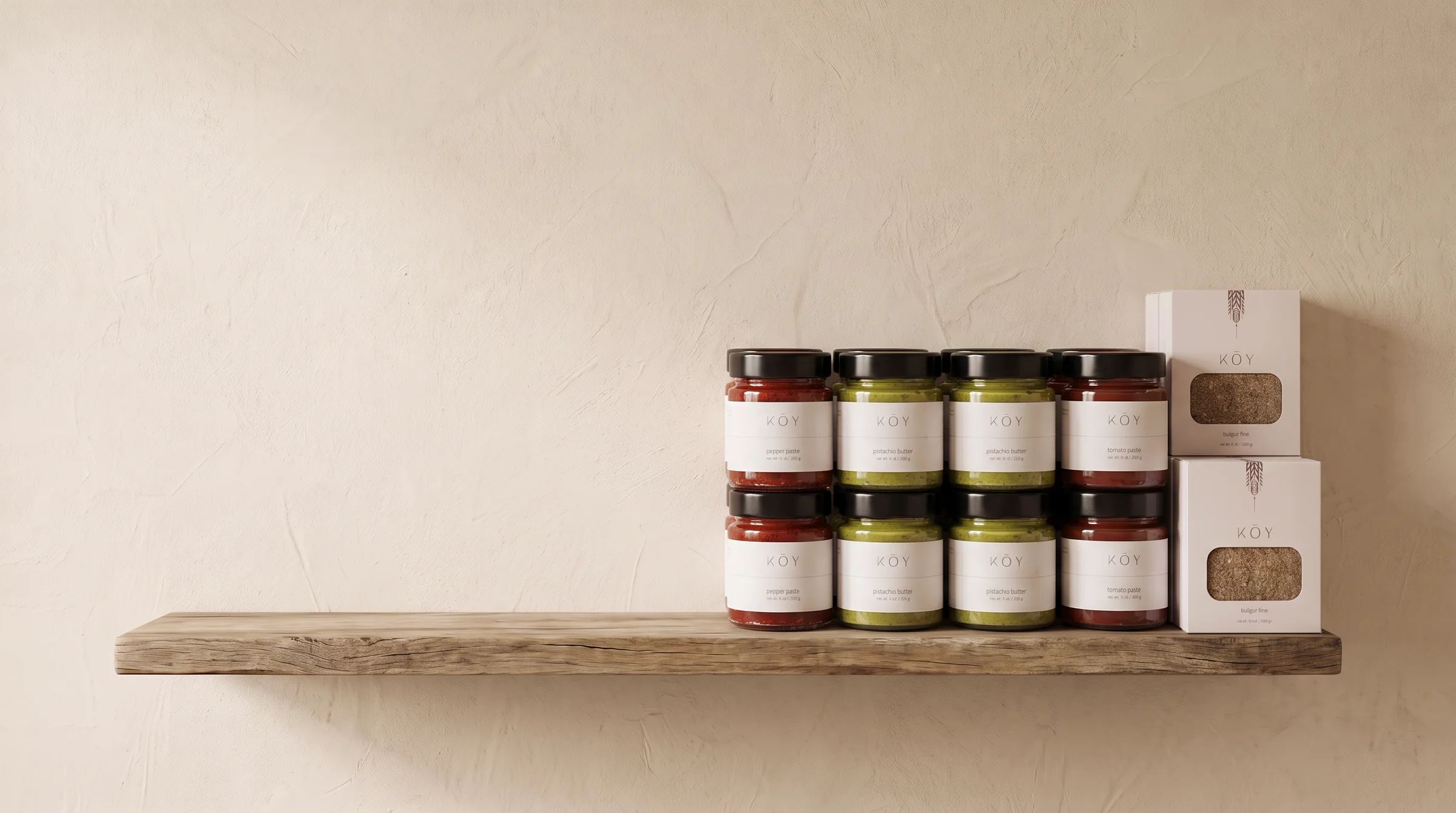 Koy Pantry jars and bulgur boxes merchandised on a wooden shelf against a plaster wall